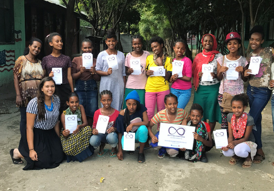 Jessica Bachansingh (first row, left) spent time in Ethiopia over the summer teaching the sewing curriculum to students and teachers involved in Girls for Confidence.